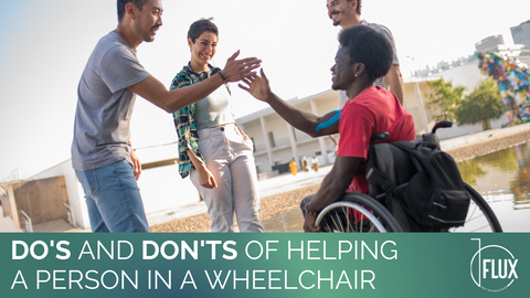 Young man in wheelchair greeting friends