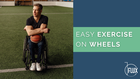 Man in wheelchair on soccer pitch