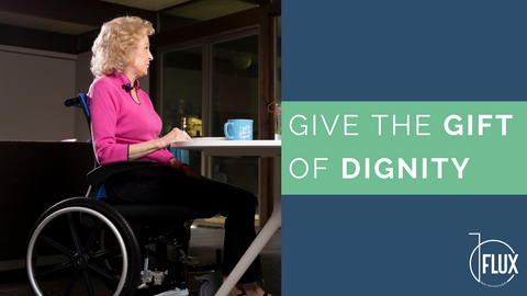 Woman in wheelchair sitting at dining table