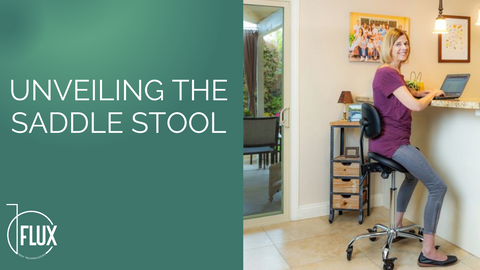 Woman on saddle stool using laptop