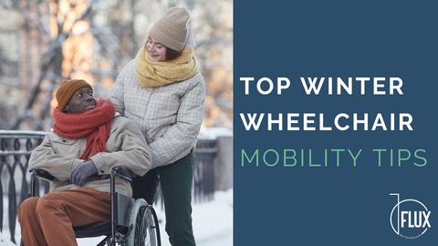 Man in wheelchair being pushed by caregiver in snowy landscape