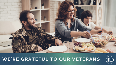 Veteran in wheelchair at dining table with family